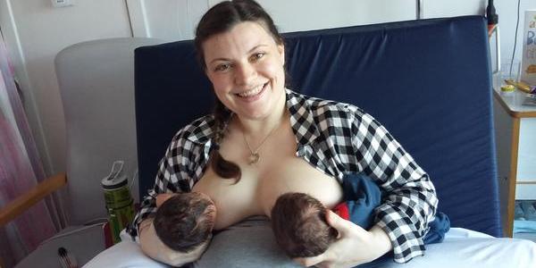 Mother breastfeeding twins