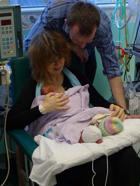 Paul and Isabel Mason and their newborn triplets 