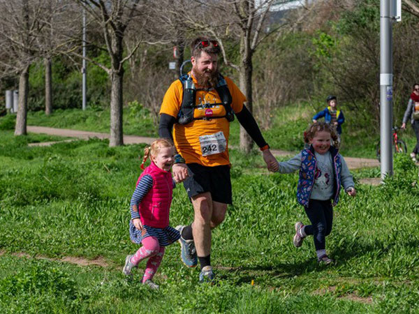 Ben with his twin girls competing in an endurance event