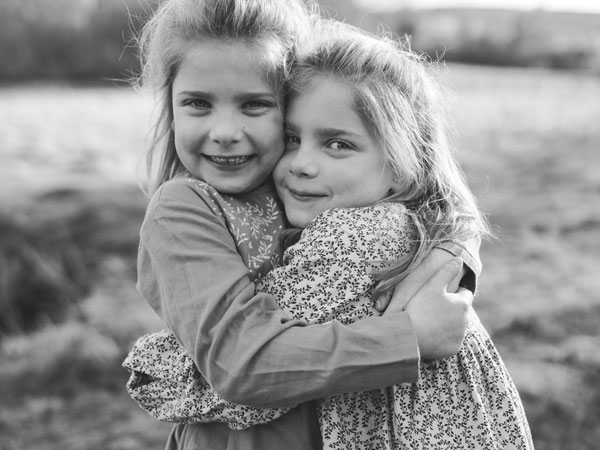 Twins Isla and Jemima hugging