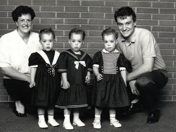 The triplets with their parents 